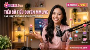 Banner tiểu sử Tiểu Quyên MMLive, cập nhật phong cách duyên dáng với ID phòng 774921. Hình ảnh nữ streamer xinh đẹp mỉm cười rạng rỡ đang ngồi trước micro trong không gian phòng live ấm áp, kèm các biểu tượng tương tác ảo và tên miền invglobal.io.