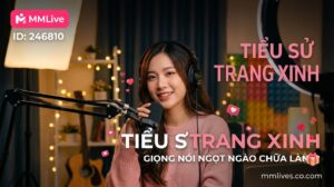 Ảnh đại diện tiểu sử idol Trang Xinh trên ứng dụng MMLive ID 246810. Nữ streamer đang mỉm cười ấm áp, đeo tai nghe và trò chuyện qua micro trong không gian phòng live thư giãn. Trên ảnh có các dòng chữ nổi bật: Tiểu sử Trang Xinh, Giọng nói ngọt ngào chữa lành cùng tên miền invglobal.io.